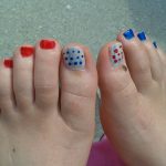 female pretty toes painted in red white and blue